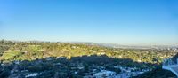 the view from a balcony of hollywood hills and hollywood mountains as seen from the hollywood bowl observation