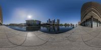 360 - ray photograph looking out over the city skyline with lake, reflection, and buildings