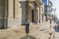 an image of a parking meter in the middle of a sidewalk in a city street