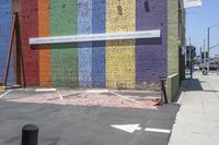 an image of a painted building in the city streets of san francisco, california where there are many words