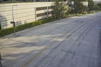 an overhead view looking down at a yellow line on a street in an empty city