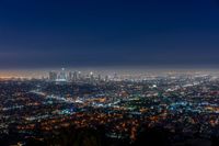 a view of the city lights of downtown at night taken from an aerial viewpoint in la