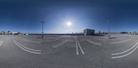 the 360 - view camera captures an empty parking lot surrounded by palm trees and airport buildings