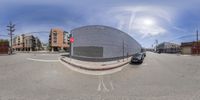 the car is stopped at a stoplight on this street corner in this 360 view