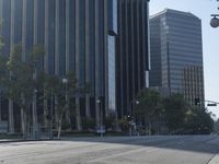 a person walking down a deserted city street with skyscrapers in the background in the daytime