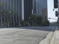 a person walking down a deserted city street with skyscrapers in the background in the daytime