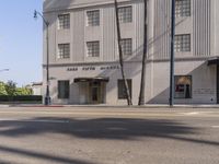 a white building with columns and a large sign that reads school street bank building on the front