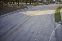 an overhead view looking down at a yellow line on a street in an empty city