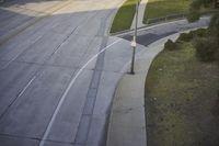 an overhead view looking down at a yellow line on a street in an empty city