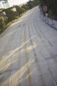 an overhead view looking down at a yellow line on a street in an empty city