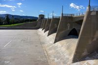 a dam that has been made into a dam wall with many ramps on it with a bike rack below