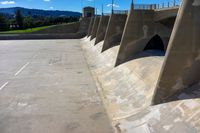 a dam that has been made into a dam wall with many ramps on it with a bike rack below