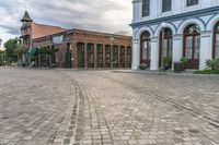 the cobblestones in an old brick road are being painted with different shades and textures