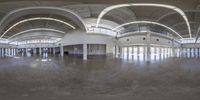 a empty, clean building with a very long ceiling in it's center of room