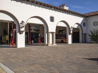 the fire station is located at the front of the building with arches and arches on the side