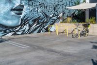 Los Angeles Graffiti: A Bicycle Wheel on the Road