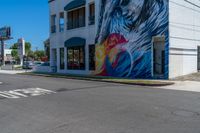 this is a street corner of a city street with the painting of a eagle on it