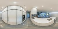 this house has curved counter and stairs leading up to the dining area and kitchen with stairs