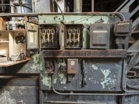 the electrical equipment in this old room is rusty and damaged, too it could be repaired