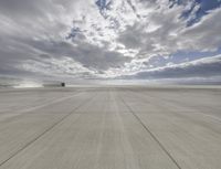 an airport that is set on top of a platform with blue sky above it and mountains in the background