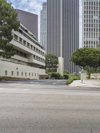 a road and the buildings next to it, with no cars in front of them