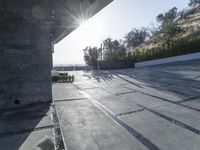 the exterior and landscape of a modern house in los angeles, california with stone and wood