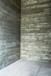 a man in the room with wood and stone walls on his face and one side showing something very cool