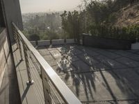 the exterior and landscape of a modern house in los angeles, california with stone and wood