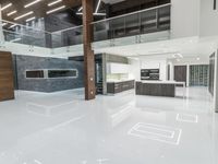 a clean looking and modern looking kitchen, with light coming through the floor to the ceiling