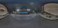 an image of a building that is inside a circle at night time that appears to be circular