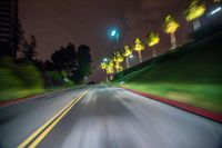 blurry shot from a vehicle with the city lights in the background at night on a street