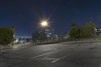 a parking lot filled with lots of parking space at night with the sun in the sky