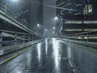 rainy night in the city at street level with road and bridge lighting up the night sky