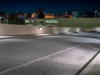 a view of a road and an overpass with traffic passing through it by buildings