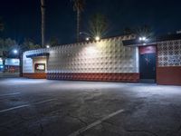 a night time shot of a food and beverage business at dusk with its lights on