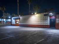 a night time shot of a food and beverage business at dusk with its lights on