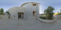 a building made with stone and a circular window to look like an observatory or stargate