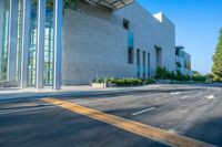 the empty streets in a modern city town on a sunny day with a clear sky