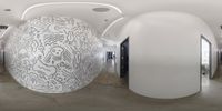 a fish eye lens image of an office lobby and hallways with large egg shapes in black ink