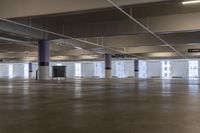 a large room with multiple levels and three level floors at various locations that includes an indoor parking lot