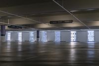 a large room with multiple levels and three level floors at various locations that includes an indoor parking lot
