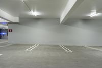 the large empty car park has no parking spots on the floor or walls at the edge