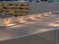 a view of a road and an overpass with traffic passing through it by buildings