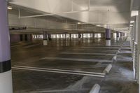 an empty parking garage with no wheels on it in the city of los angeles, california