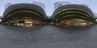 several different angles of a view of a parking garage in a city center with buildings