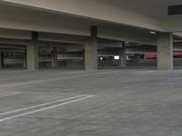 a parking garage with no one walking in the place but this is empty parking garage