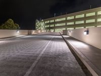 a view of a road and an overpass with traffic passing through it by buildings