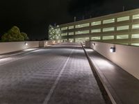 a view of a road and an overpass with traffic passing through it by buildings