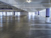 a parking lot with lots of parking spaces in it and several chairs in the ground