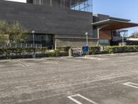 an empty parking lot in front of a building that has been designed to look like a mall